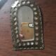 Ethnic brass mirrors.