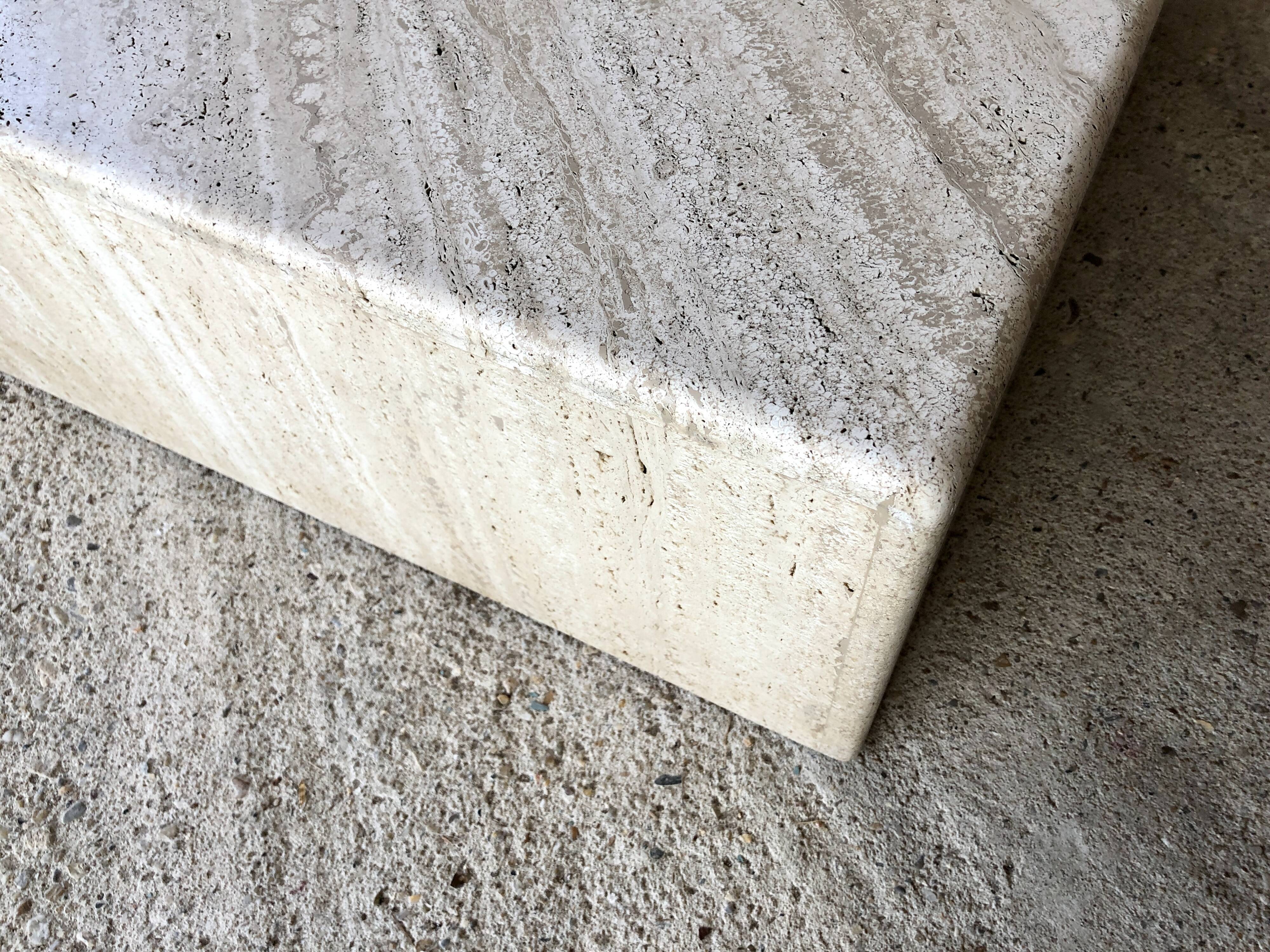 Pair of triangular coffee tables in travertine, Italy circa 70 / 80