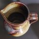 20th century glazed terracotta pitcher