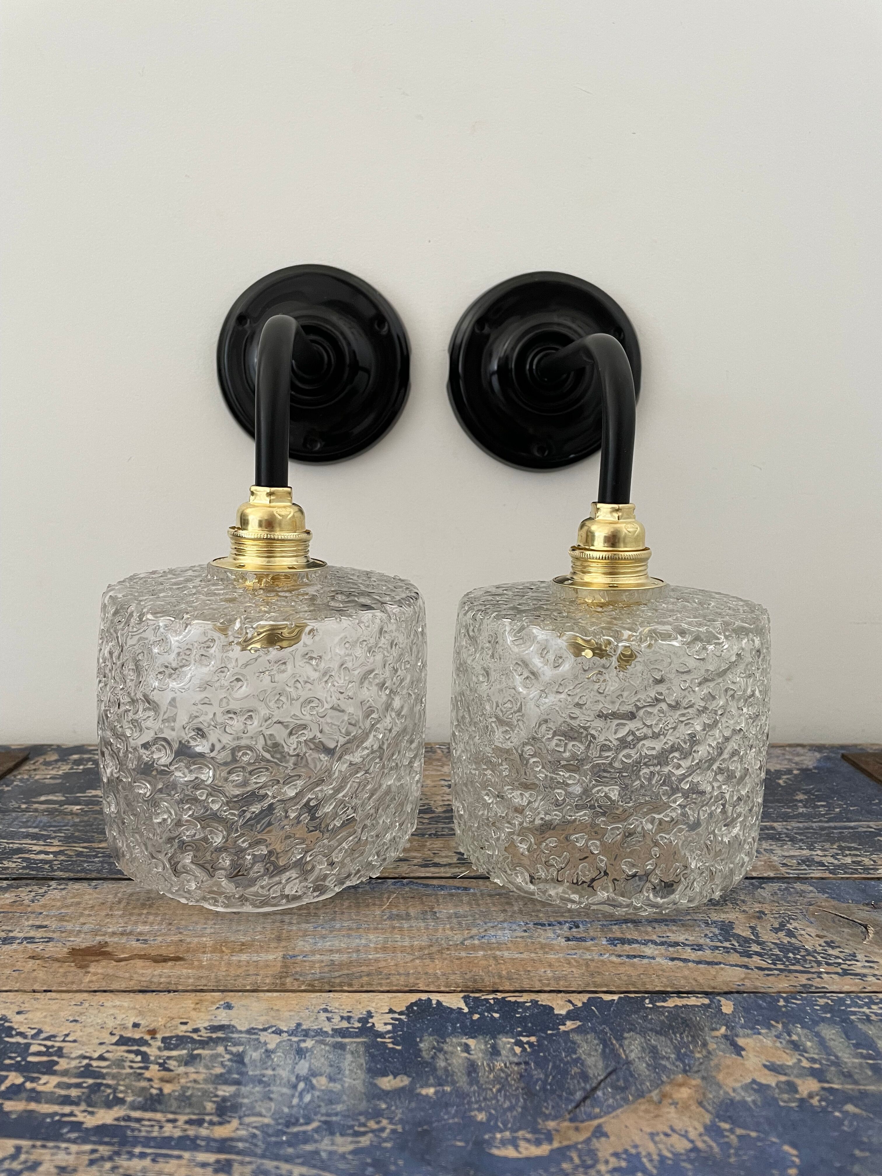 Set of two chiseled glass sconces