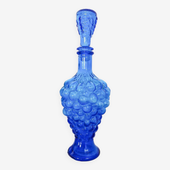 Vintage blue glass carafe in the shape of a bunch of grapes