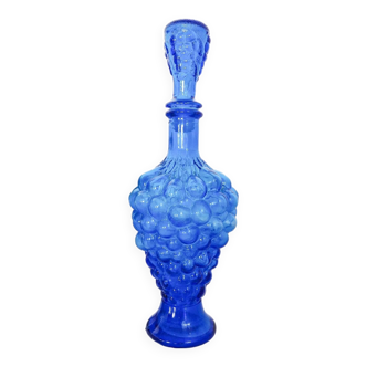 Vintage blue glass carafe in the shape of a bunch of grapes