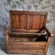 Rustic French antique storage bench from the 18th century in walnut and pine.