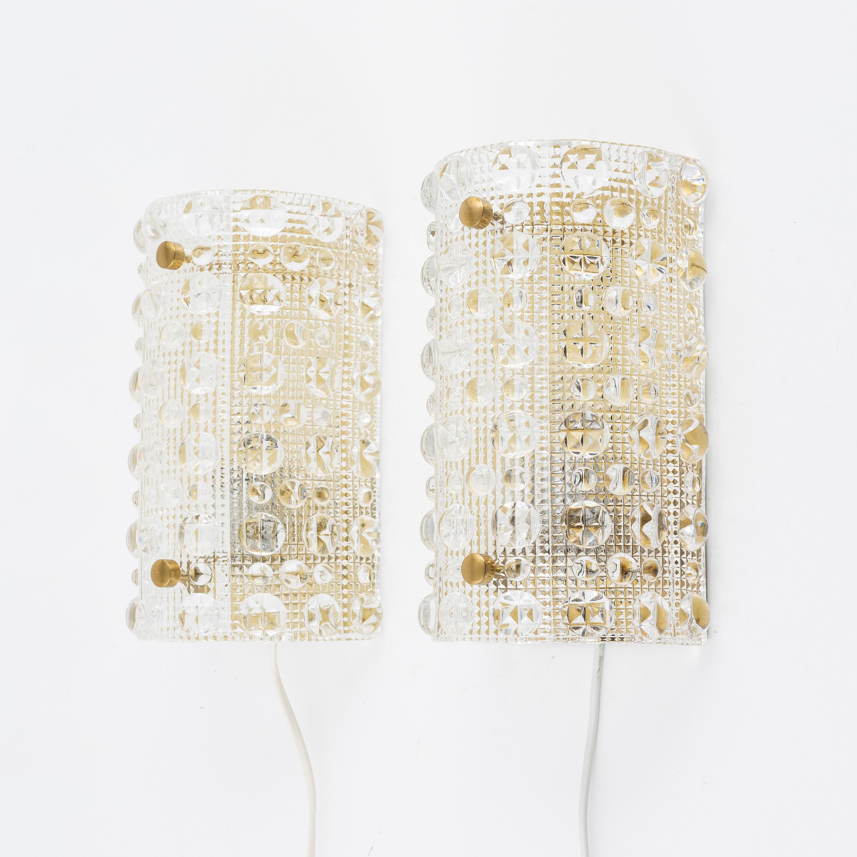 Carl Fagerlund, pair of glass wall lights for Lyfa, Orrefors Sweden, 1960.