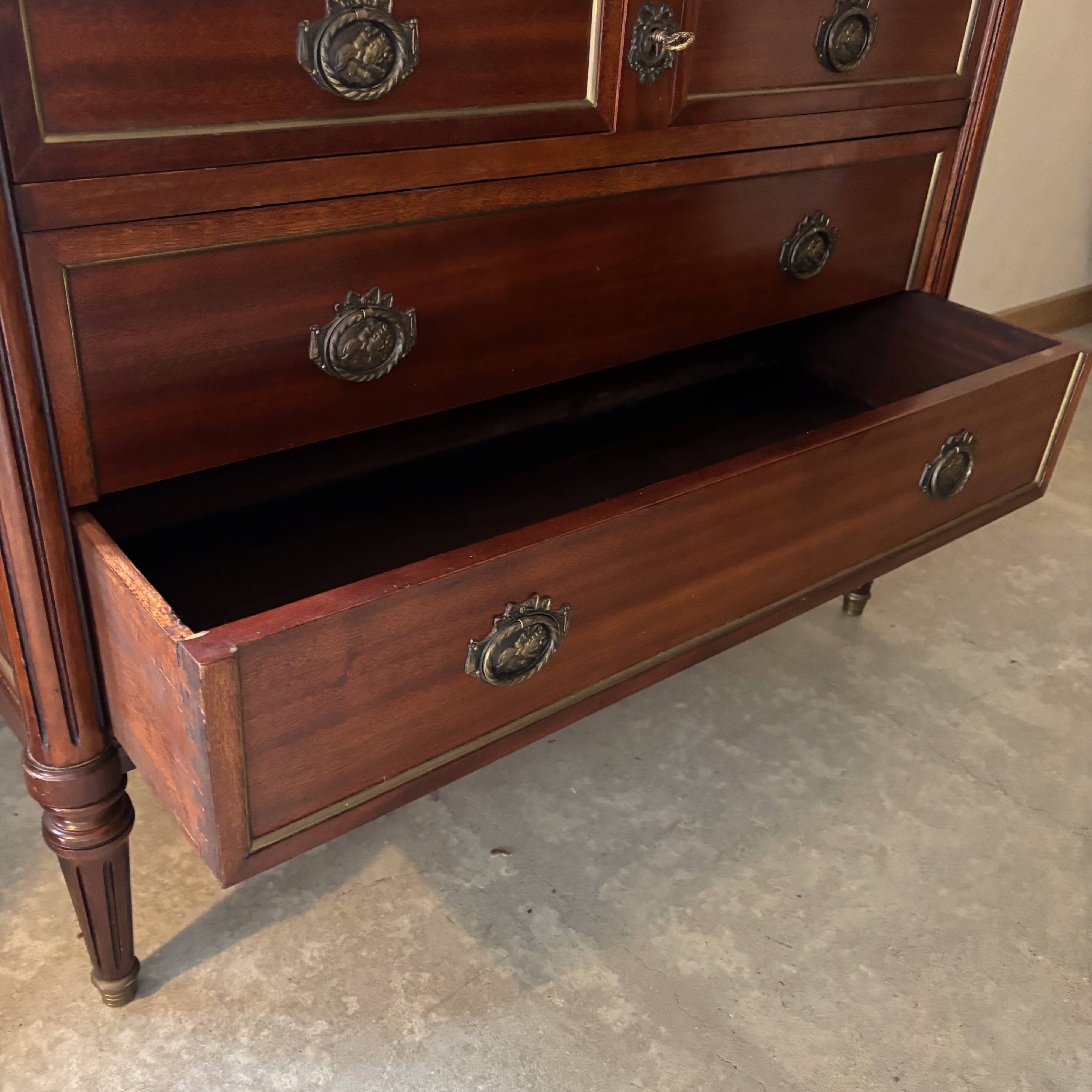 Louis XVI style commode with a shaped marble top.