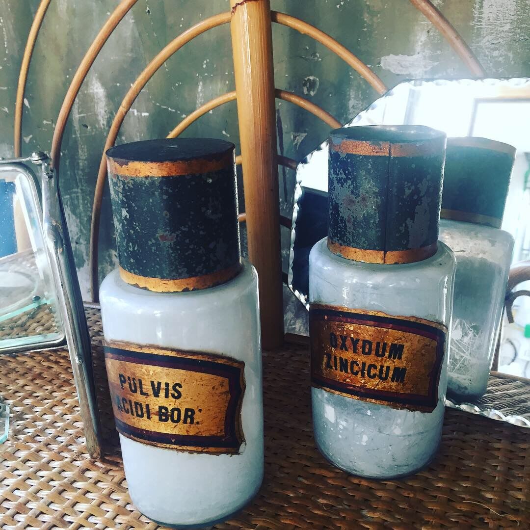 Two old pharmacy jars