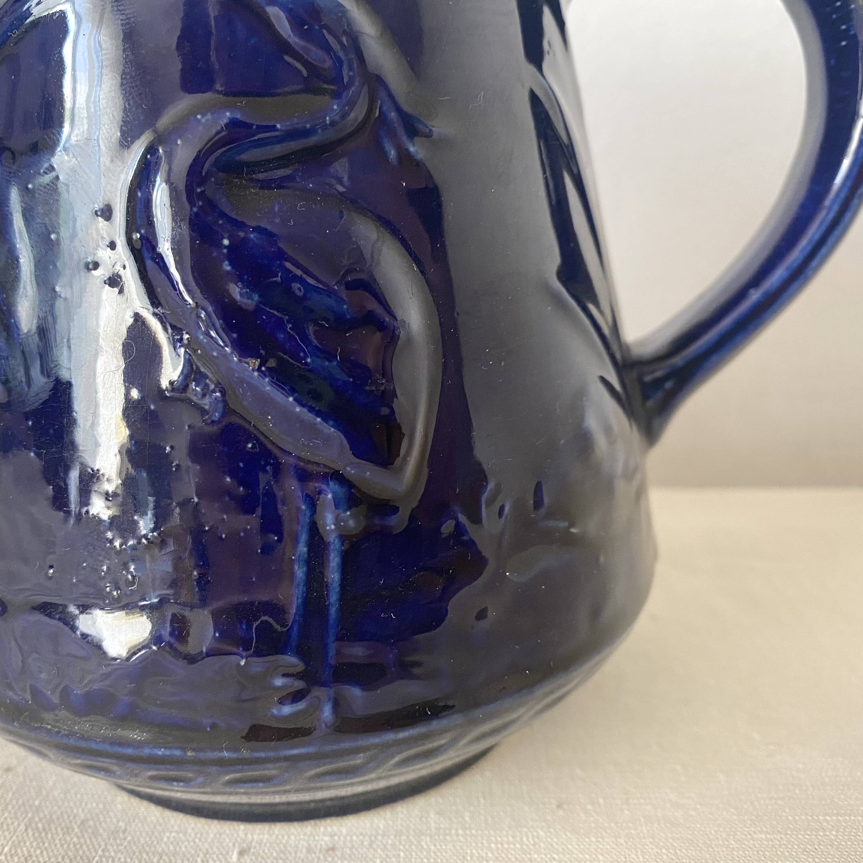 Heron slip jug made in England