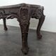 Louis XV coffee table in carved walnut with a gilded leather top.