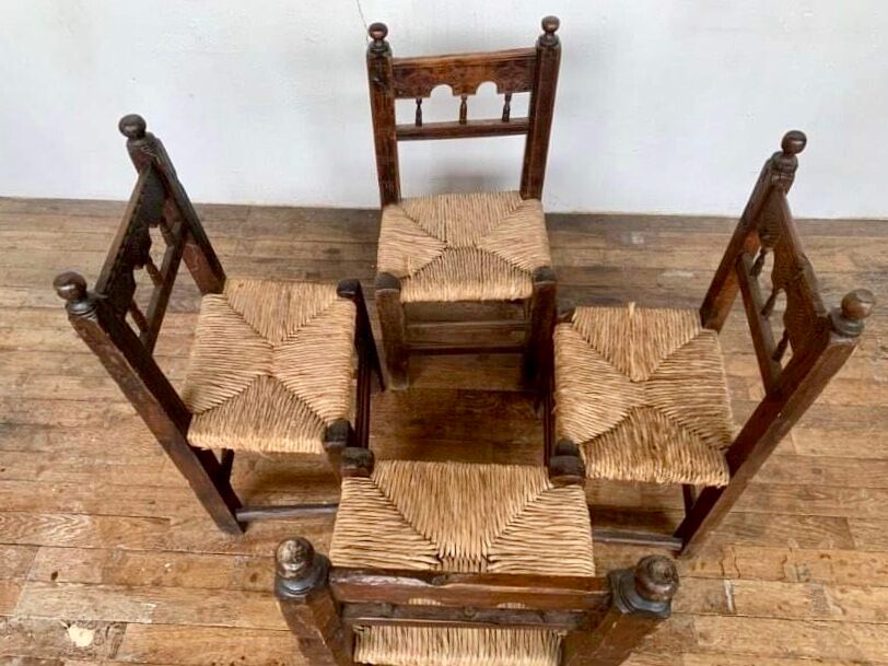 Series of 4 brutalist rustic chairs in carved wood straw seat