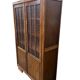 Vintage wooden display cabinet with textured glass.