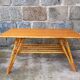 Rattan coffee table with compass legs