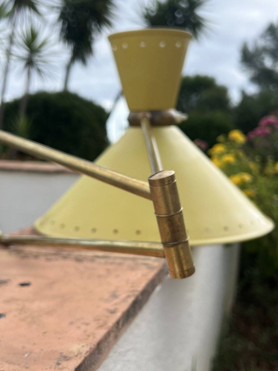 Diabolo wall lamp lunel yellow in the style of René Mathieu Guariche, star sheet metal.