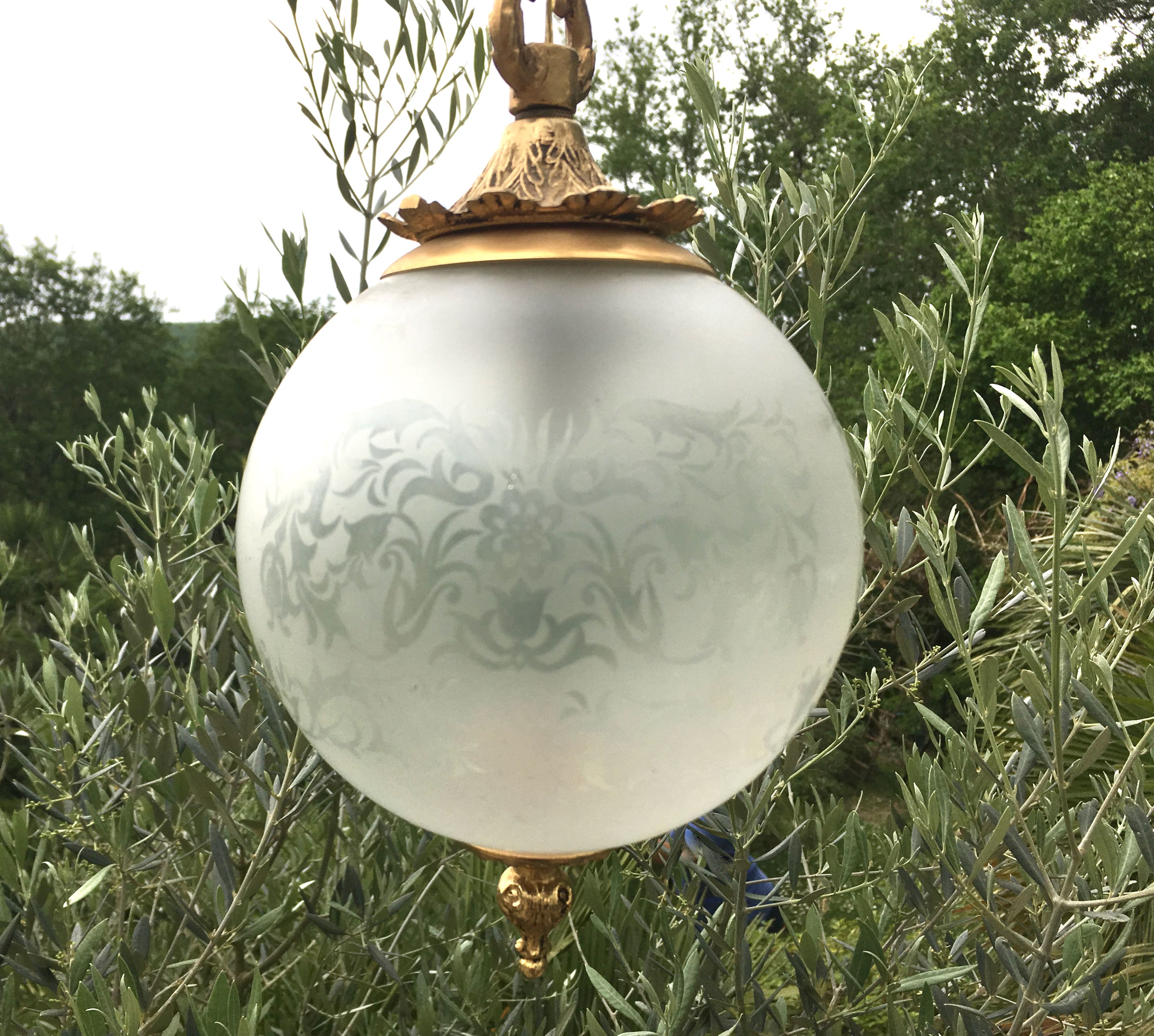 Floral globe and gold metal hanging lamp