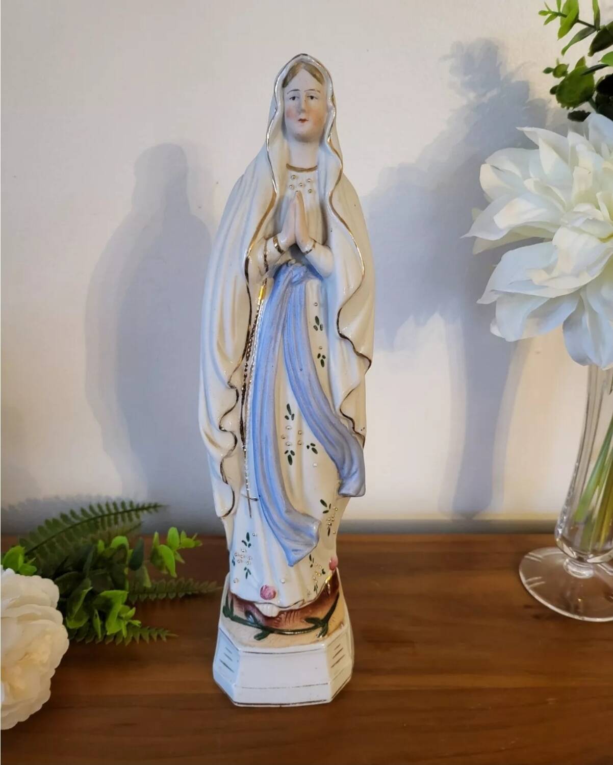 Religious statuette of the Virgin Mary in bisque porcelain