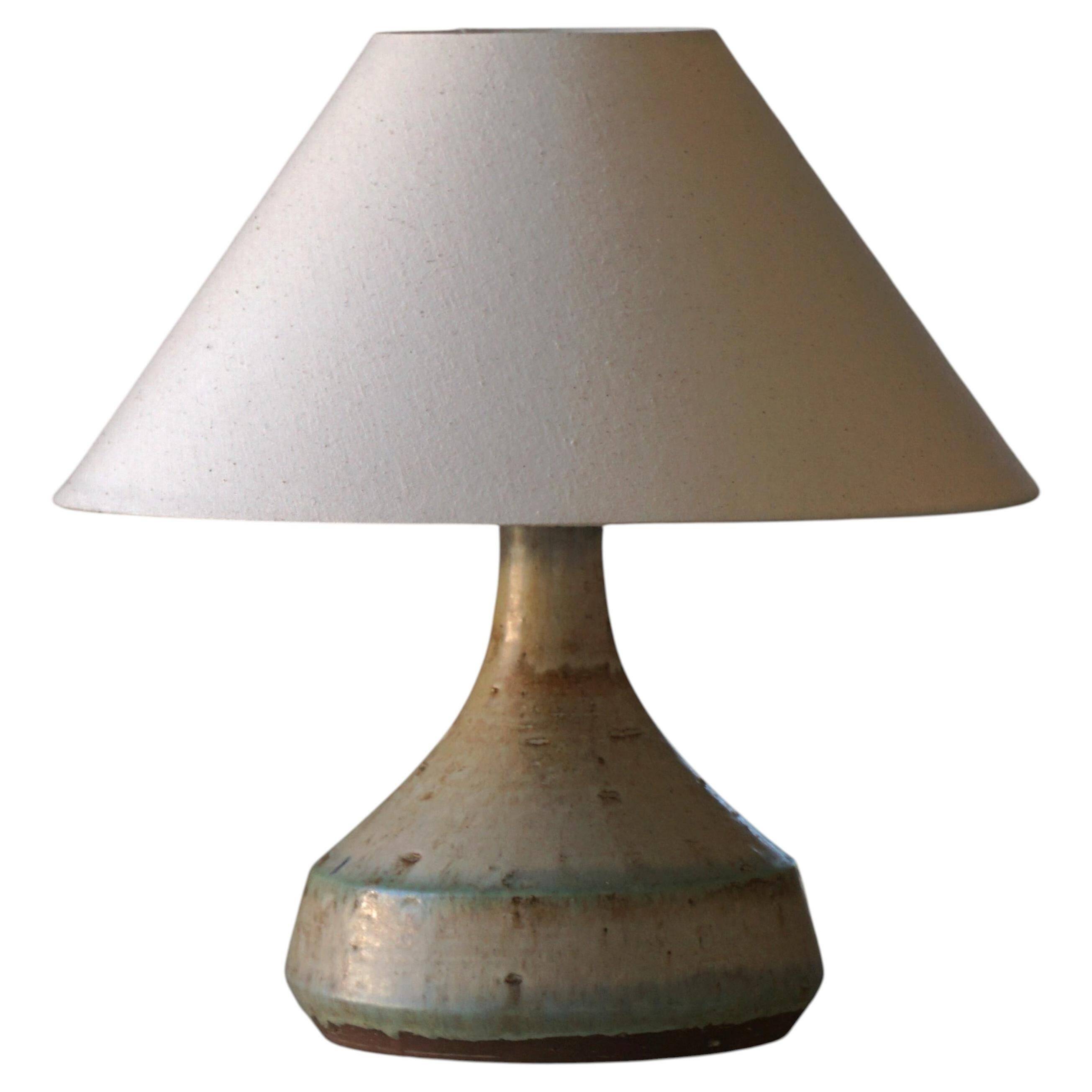 Modern Danish decorative table lamp in stoneware with flared base, Denmark, 1960s.