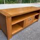 Solid pine wood TV unit stained with drawer and storage.
