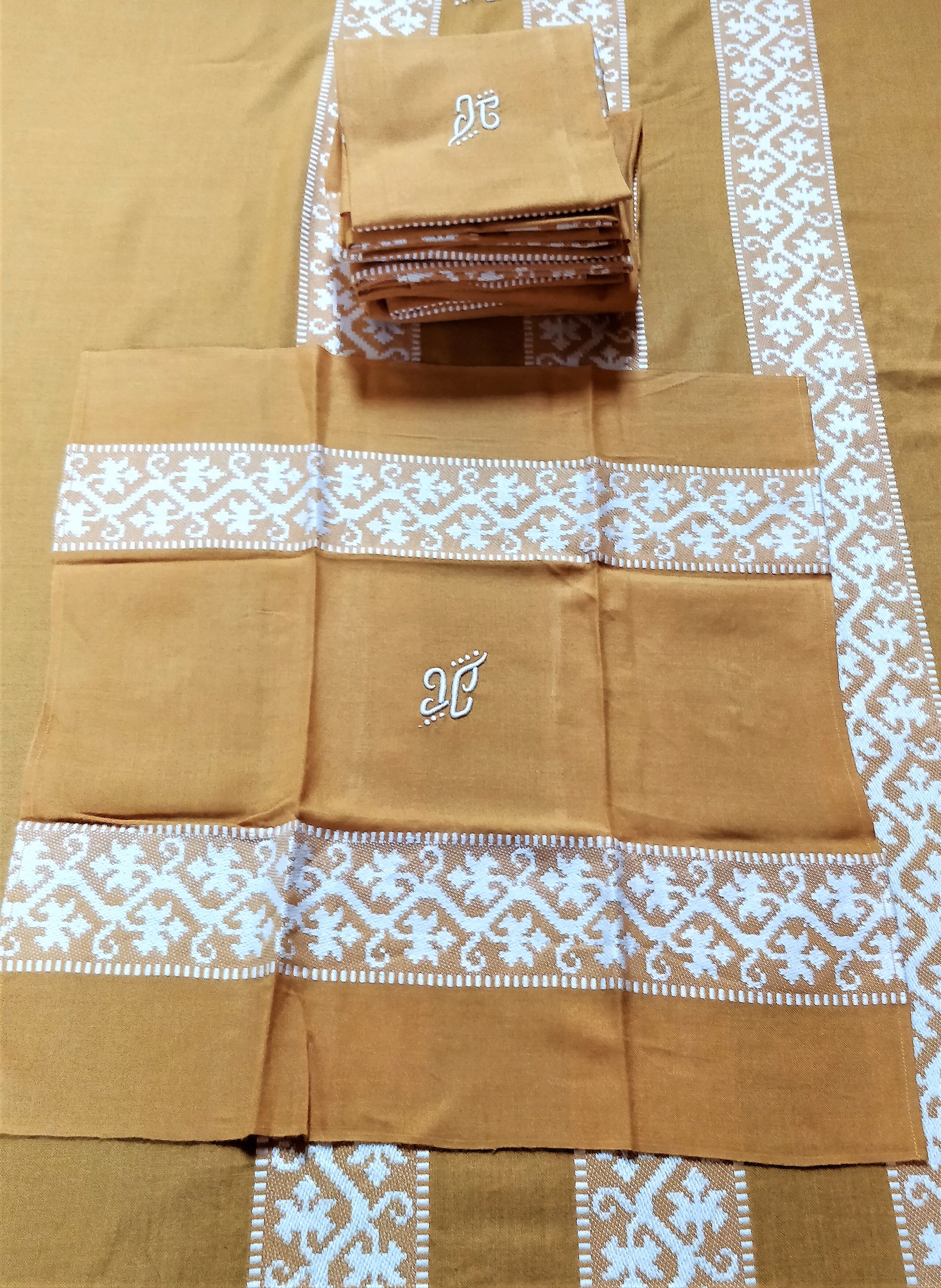 Mustard yellow tablecloth with towels