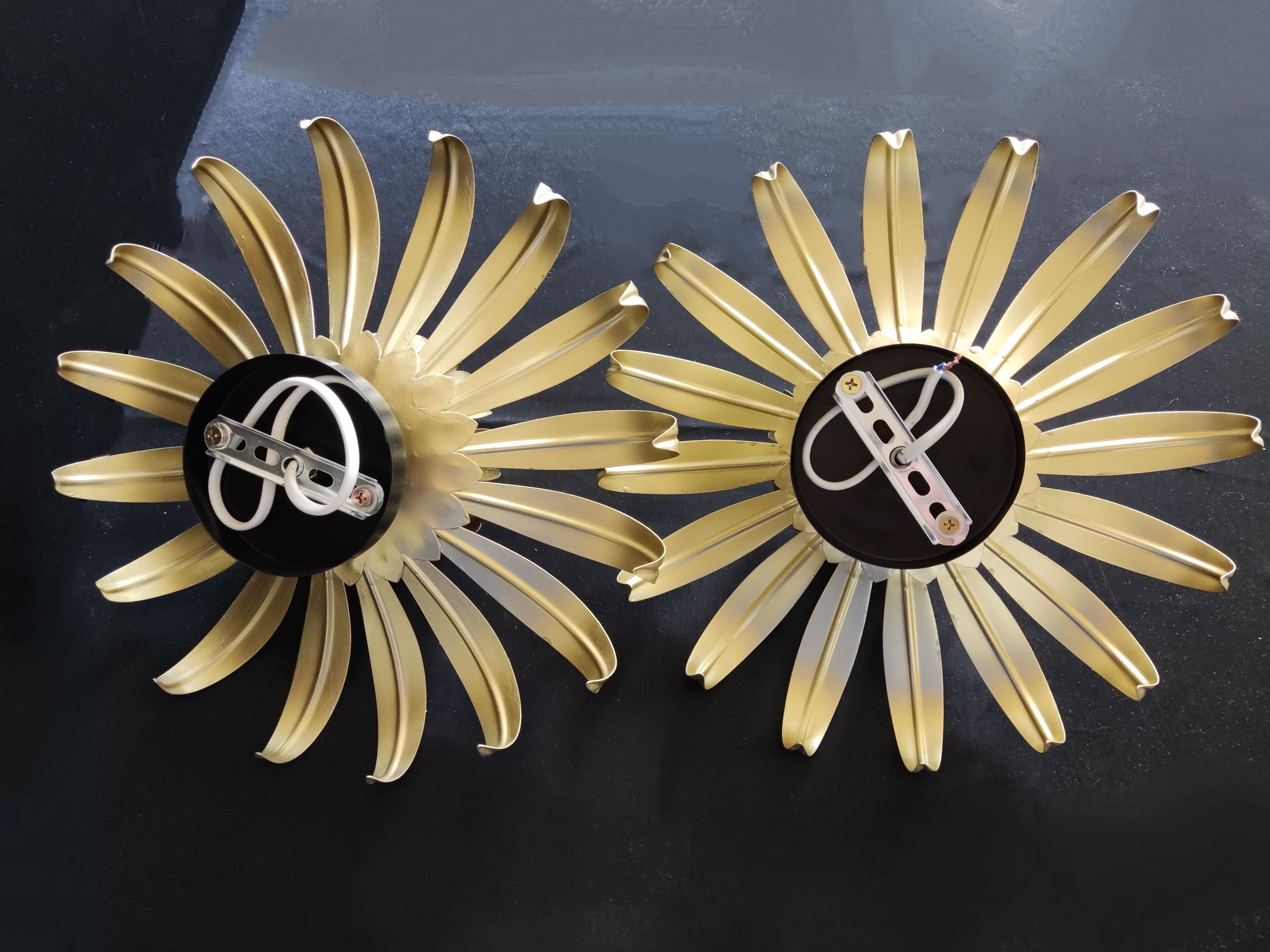 Golden metal flower sconces