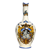 Gien earthenware jug, Renaissance decoration, putto with dolphin.