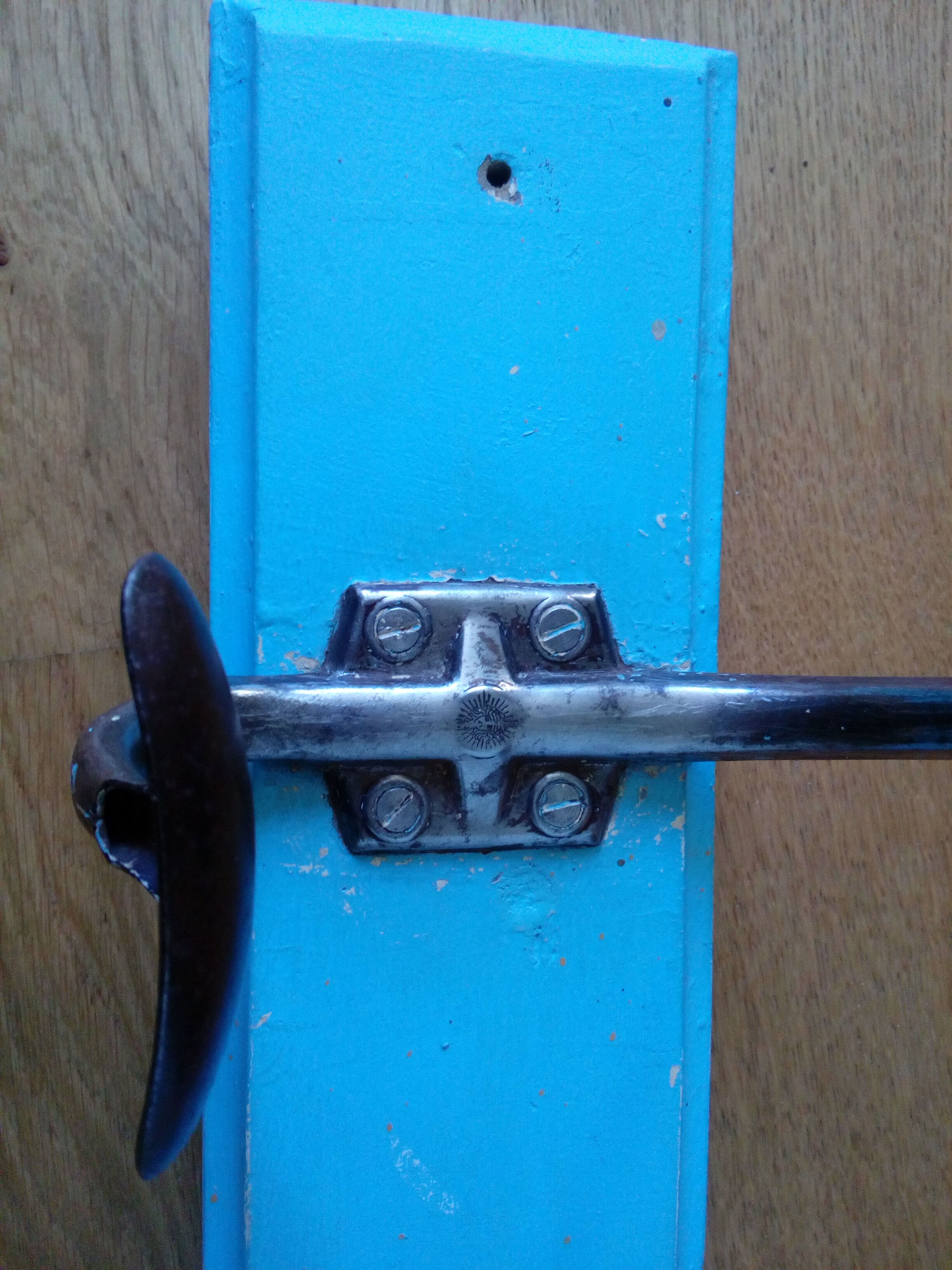 Wall coat holder with two metal pads