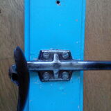 Wall coat holder with two metal pads