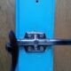 Wall coat holder with two metal pads