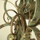Lustre 8 branches en fer forgé patine gris de vert  et dorure ancien