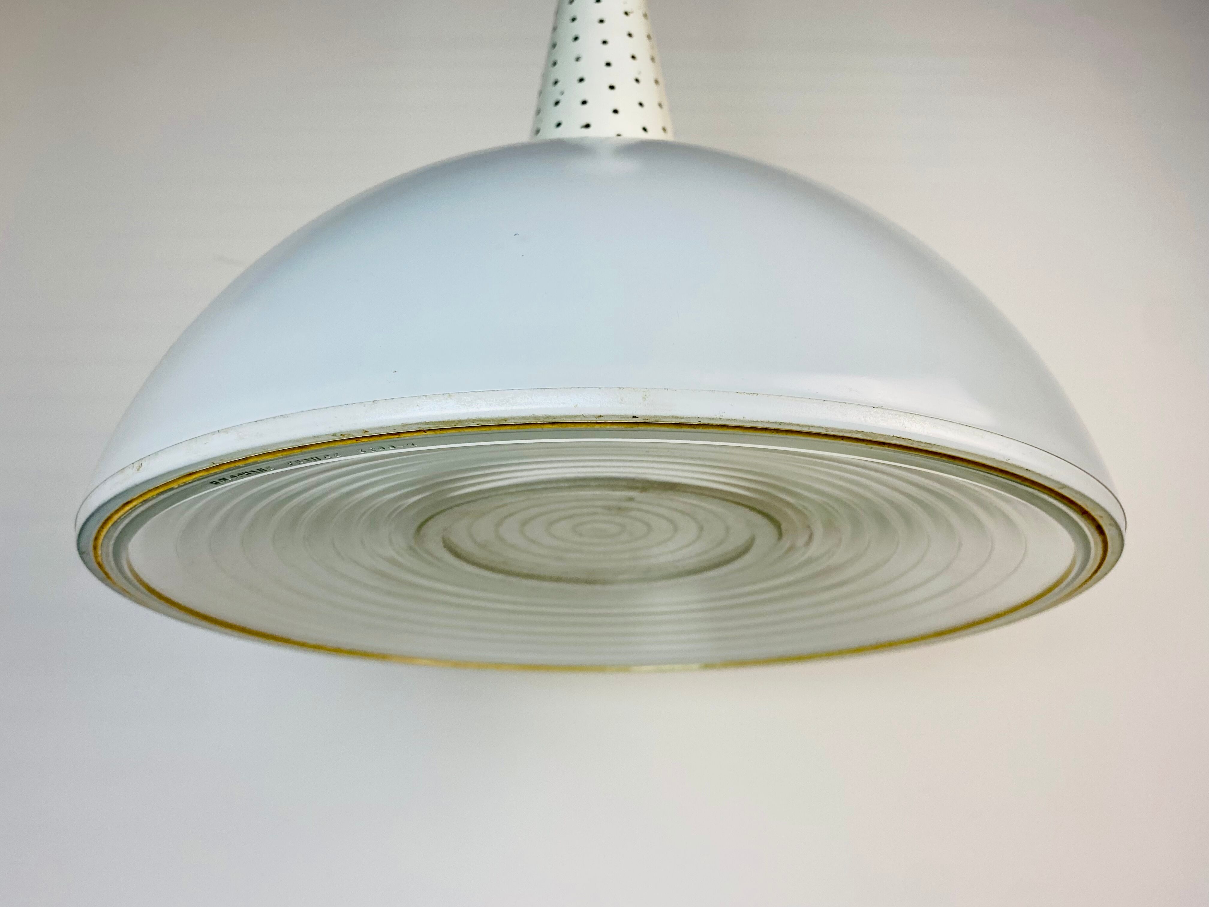 Perforated metal suspension holophanous glass