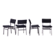 Set of four entirely black Hulmefa dining chairs, Architectural Modernism.