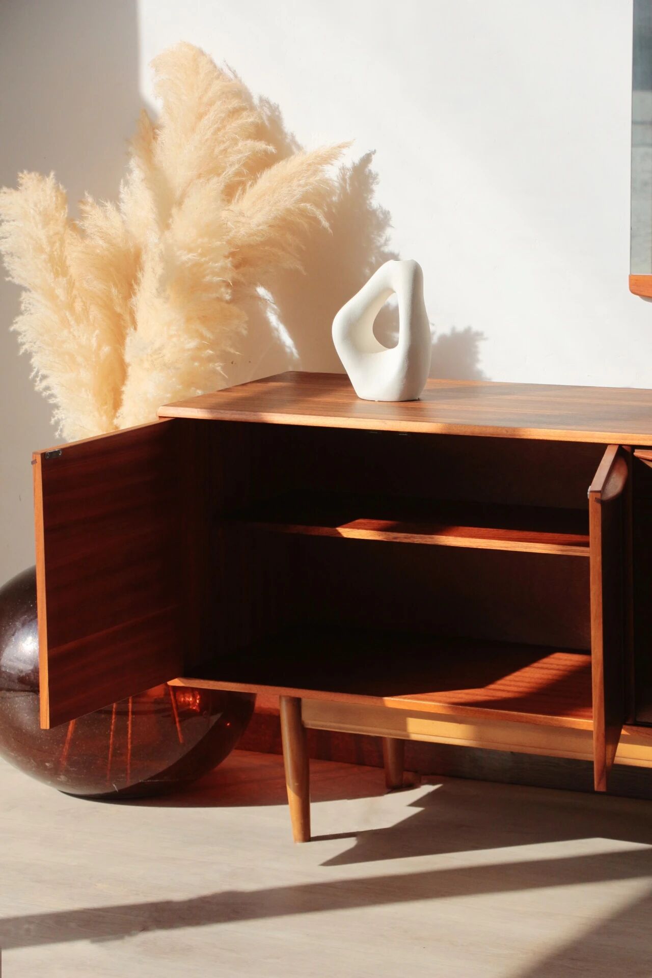 Vintage zebrano and walnut furniture from Morris of Glasgow.