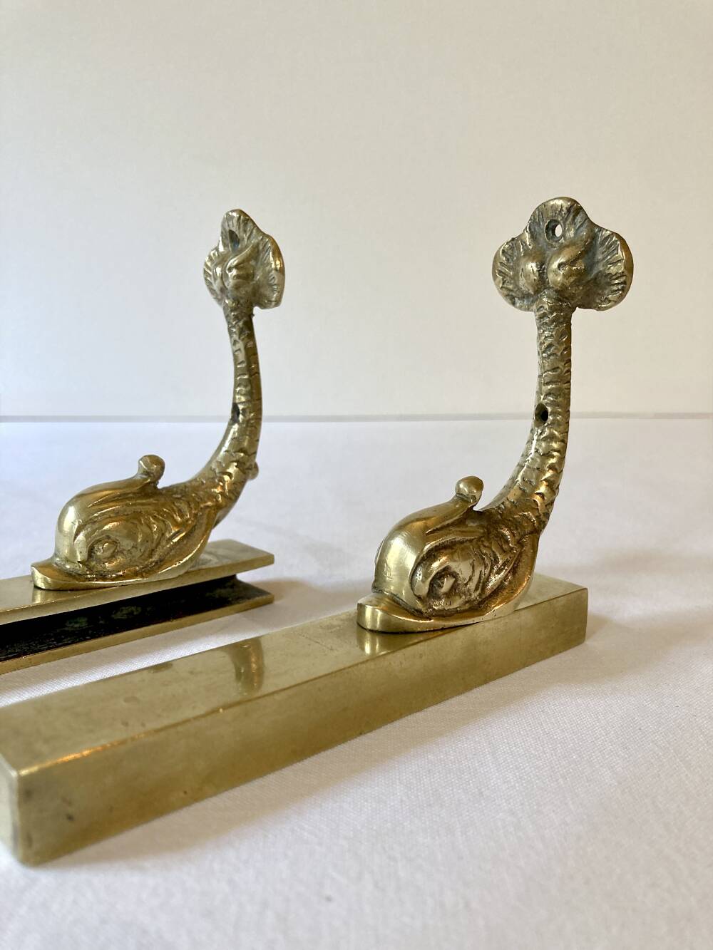 Brass wall supports for bathroom shelf, circa 1950.