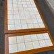 Dining table or farmhouse kitchen style with solid wood and tiles.