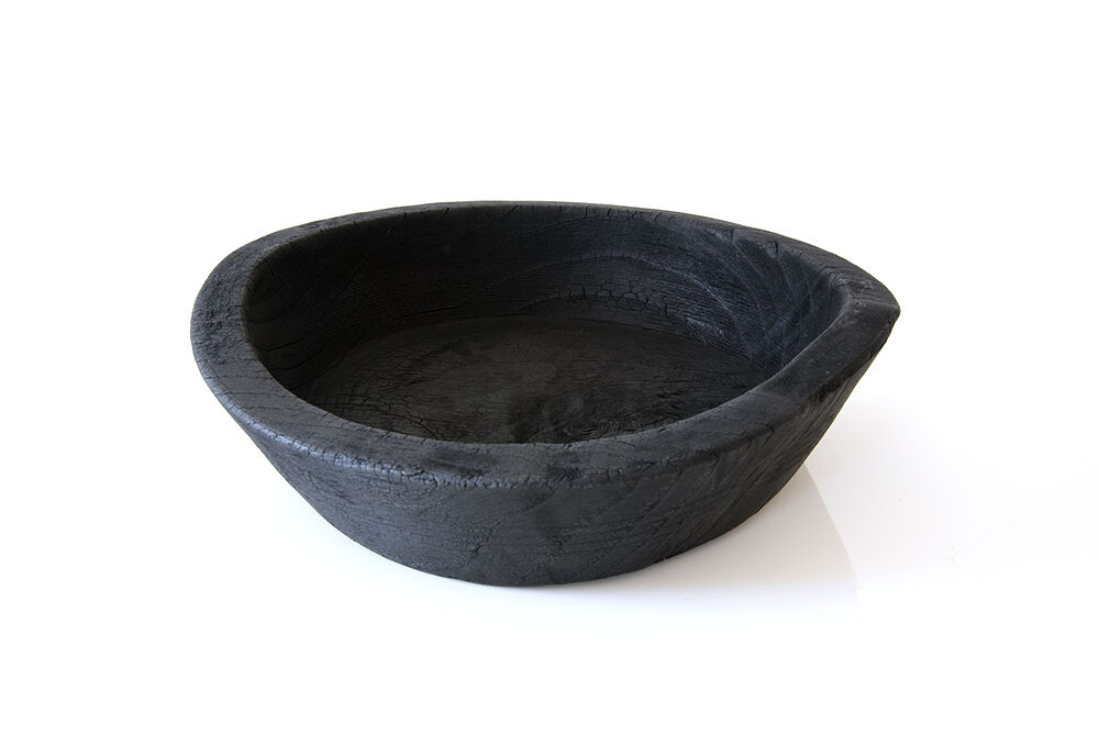 Cut / empty pocket in burning wood. shou-sugi-ban