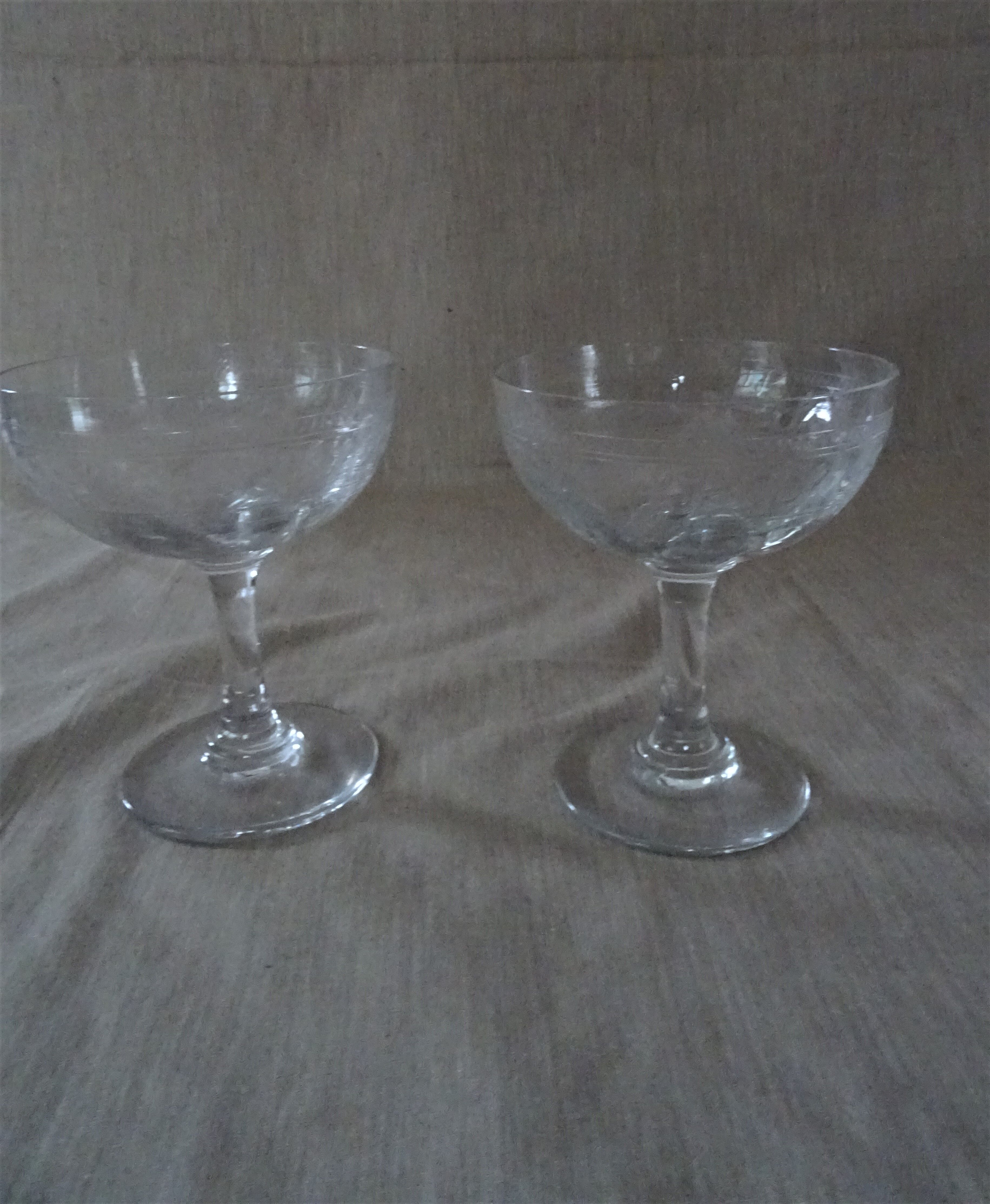 Pair of old crystal champagne glasses wide frieze right foot
