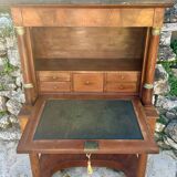 A small piece of Bonheur du jour with detached columns in Empire-era mahogany.
