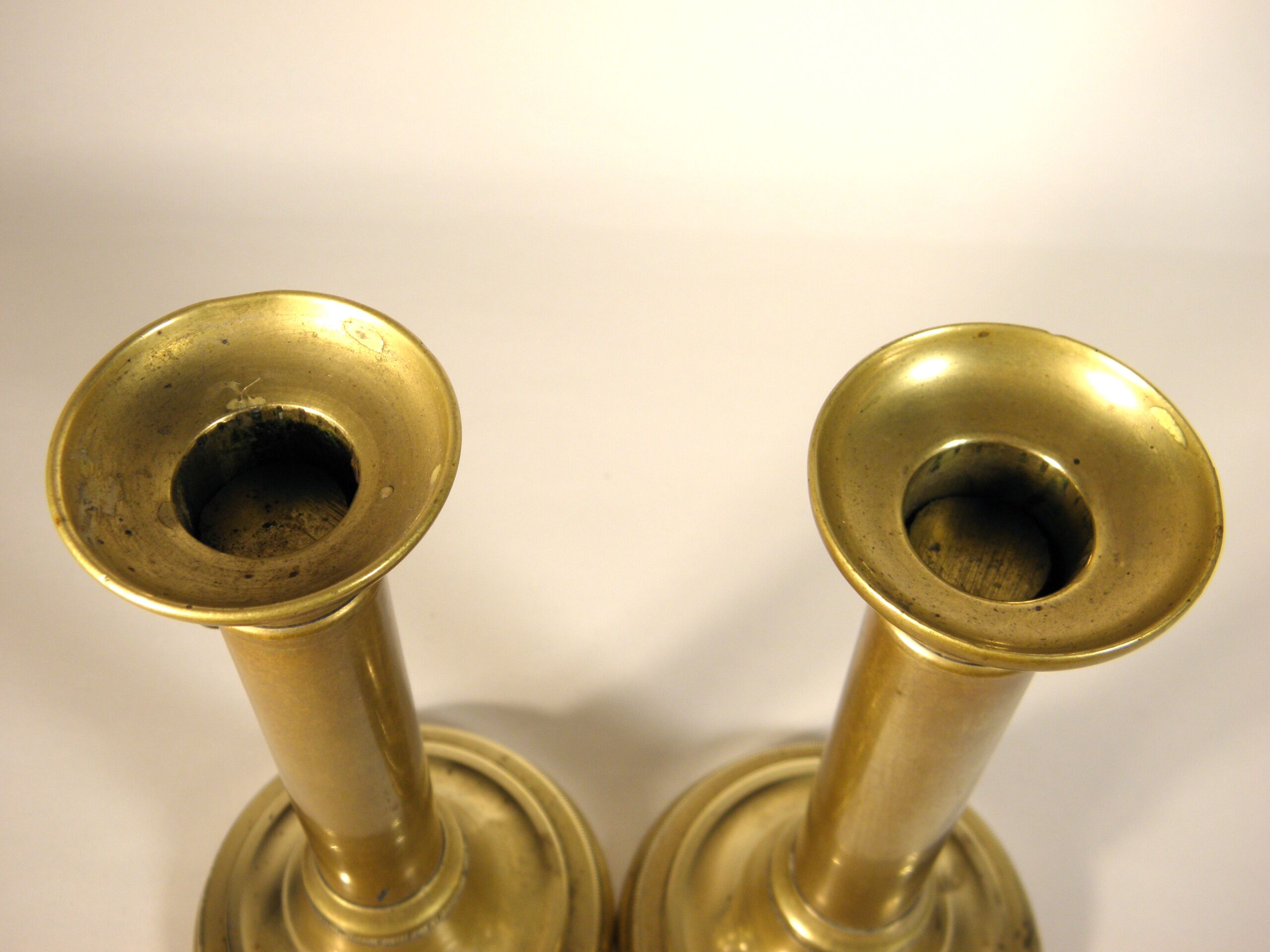 Pair of brass push candlesticks