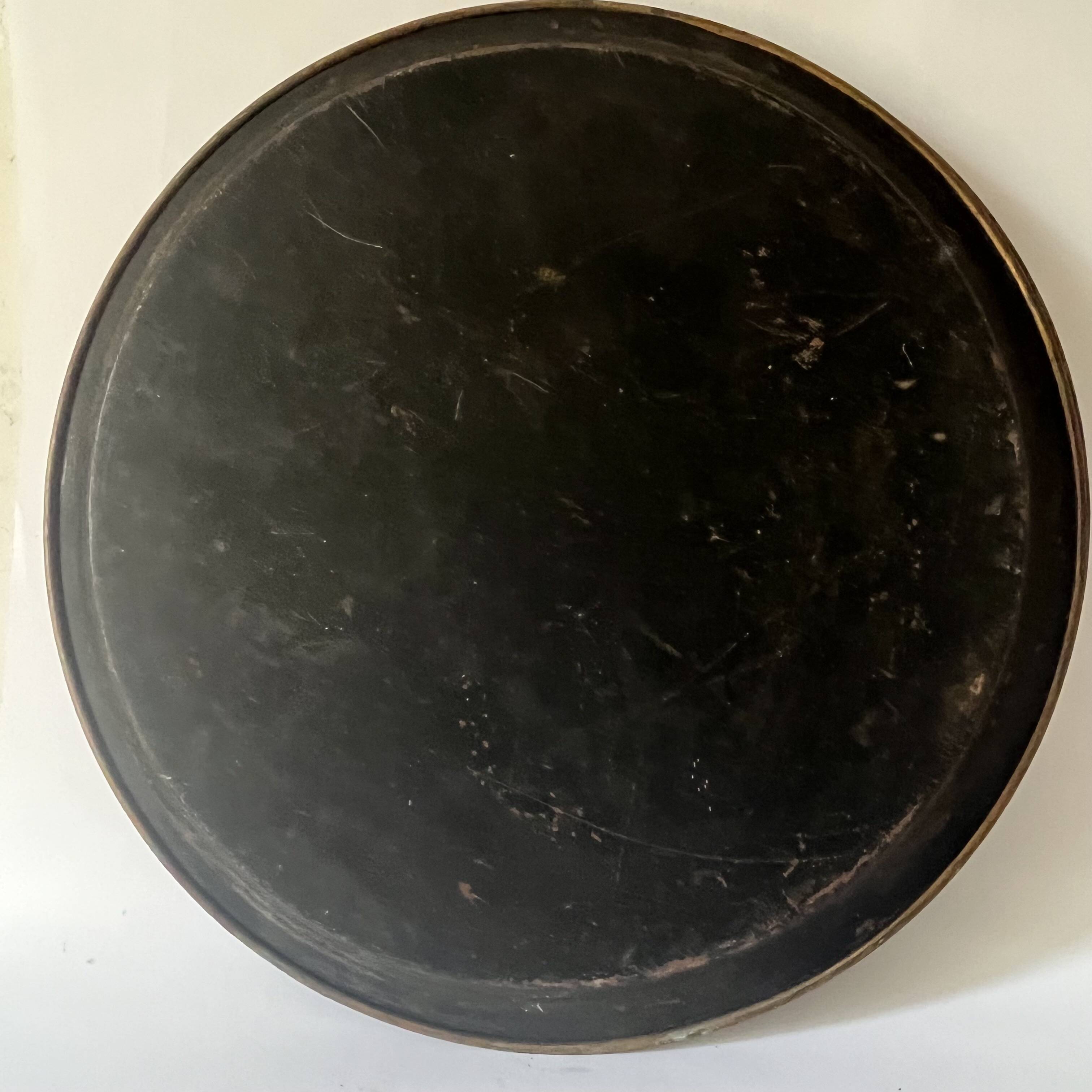 Two old trays on a stand/console.