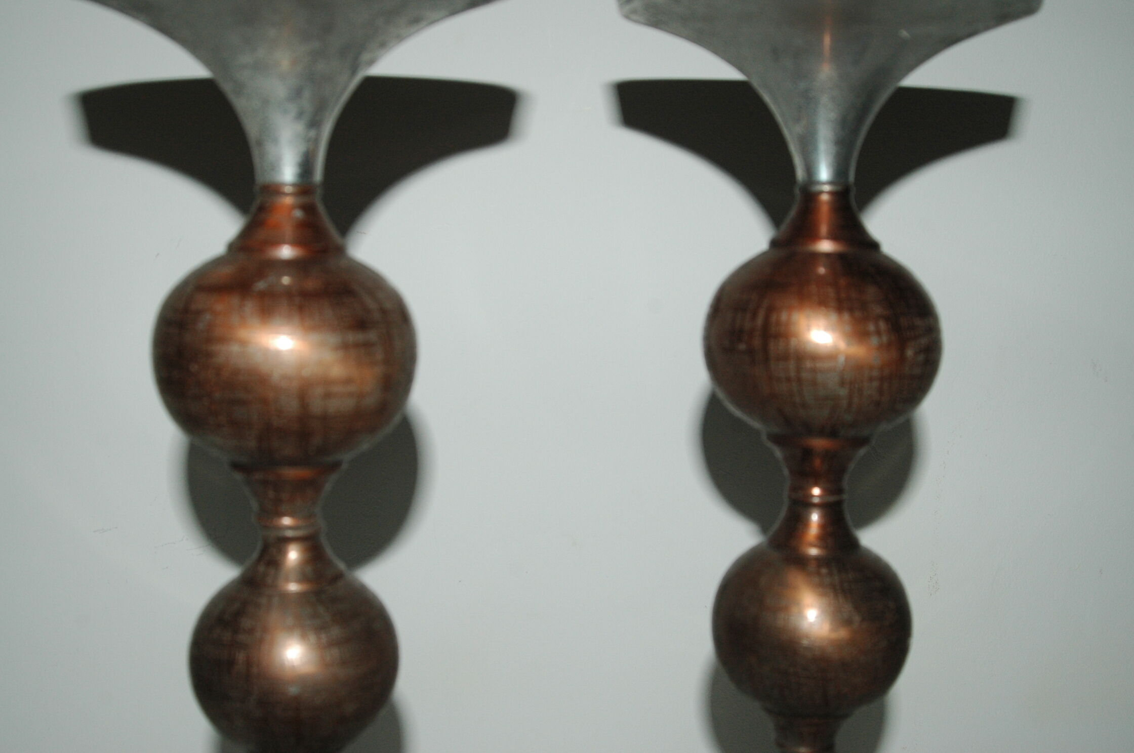 Pair of brutalist aluminum and copper candle holder