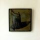 Glazed chamotte clay plaque in grey-green and black, decorated with a rower.
