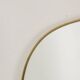 Miroir cerclé de laiton doré. 1980