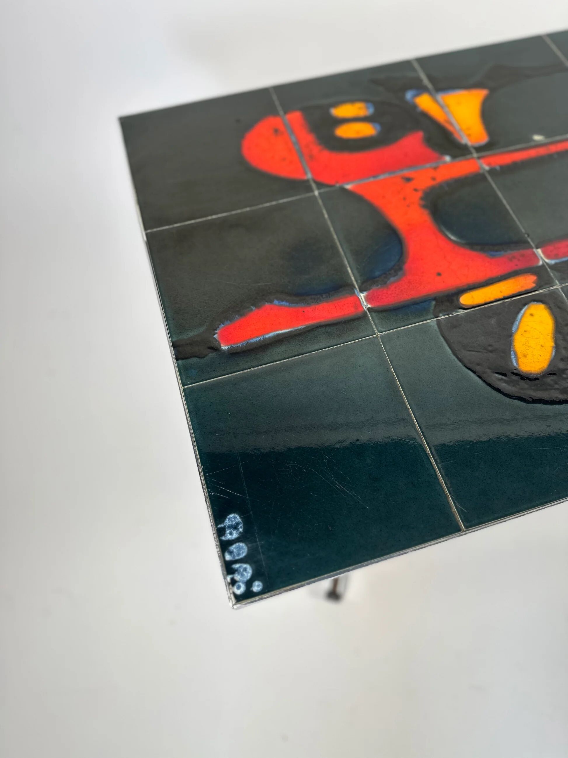 Mid-century coffee table with ceramic top by Adri Belgium.