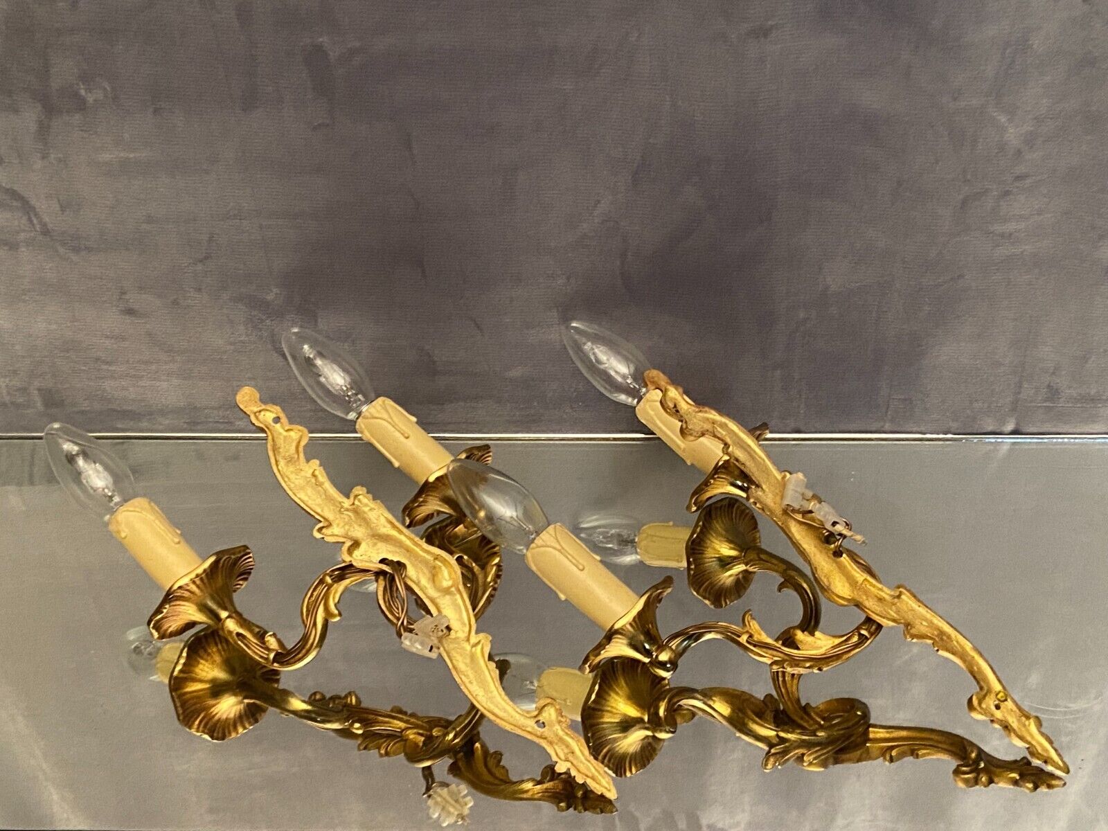 Pair of Louis XV style gilded bronze sconces