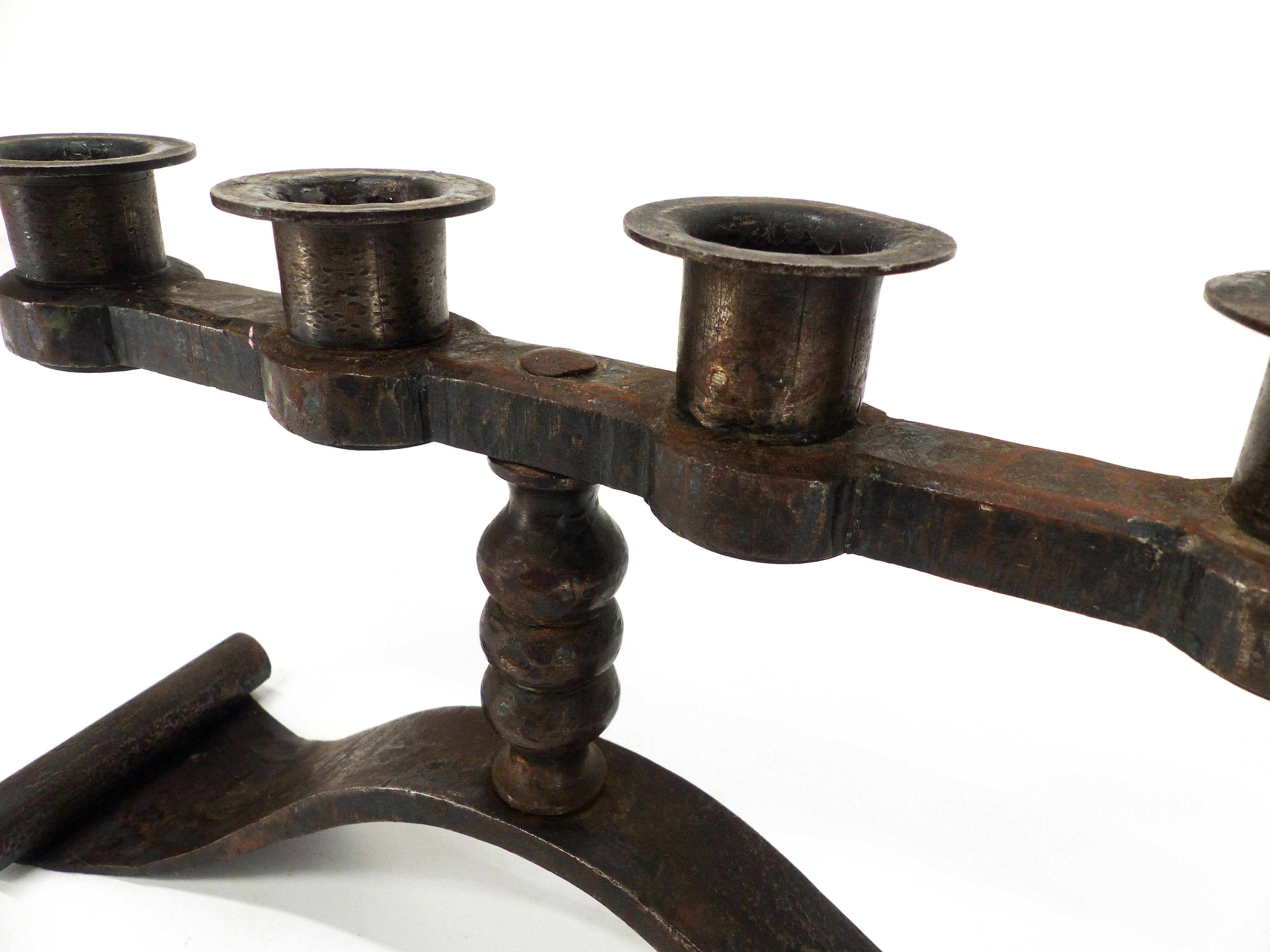 Wrought iron chandelier with four lights, Charles Piguet, Switzerland, circa 1930.