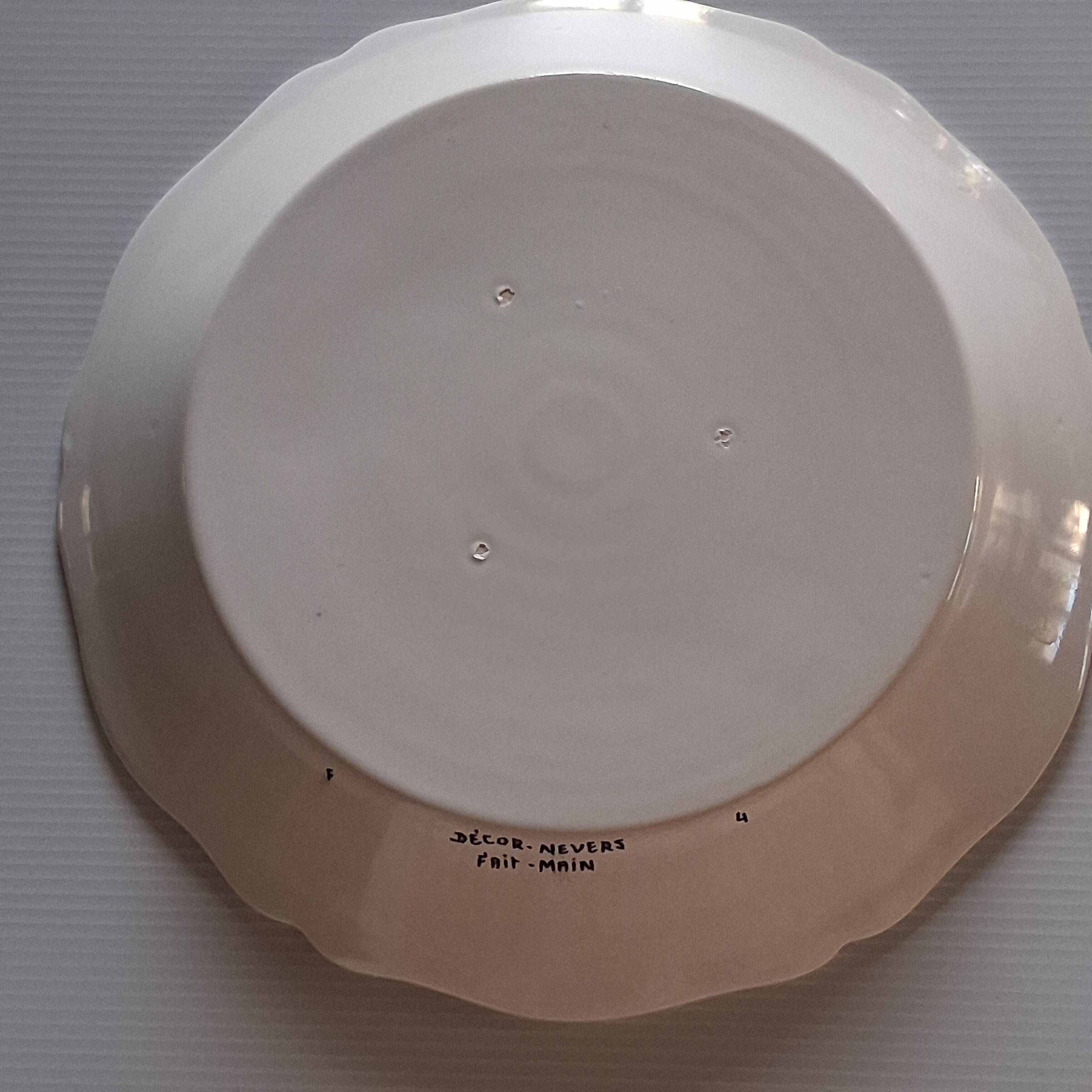 Slightly hollow dish with wavy edge in very good condition from Nevers.