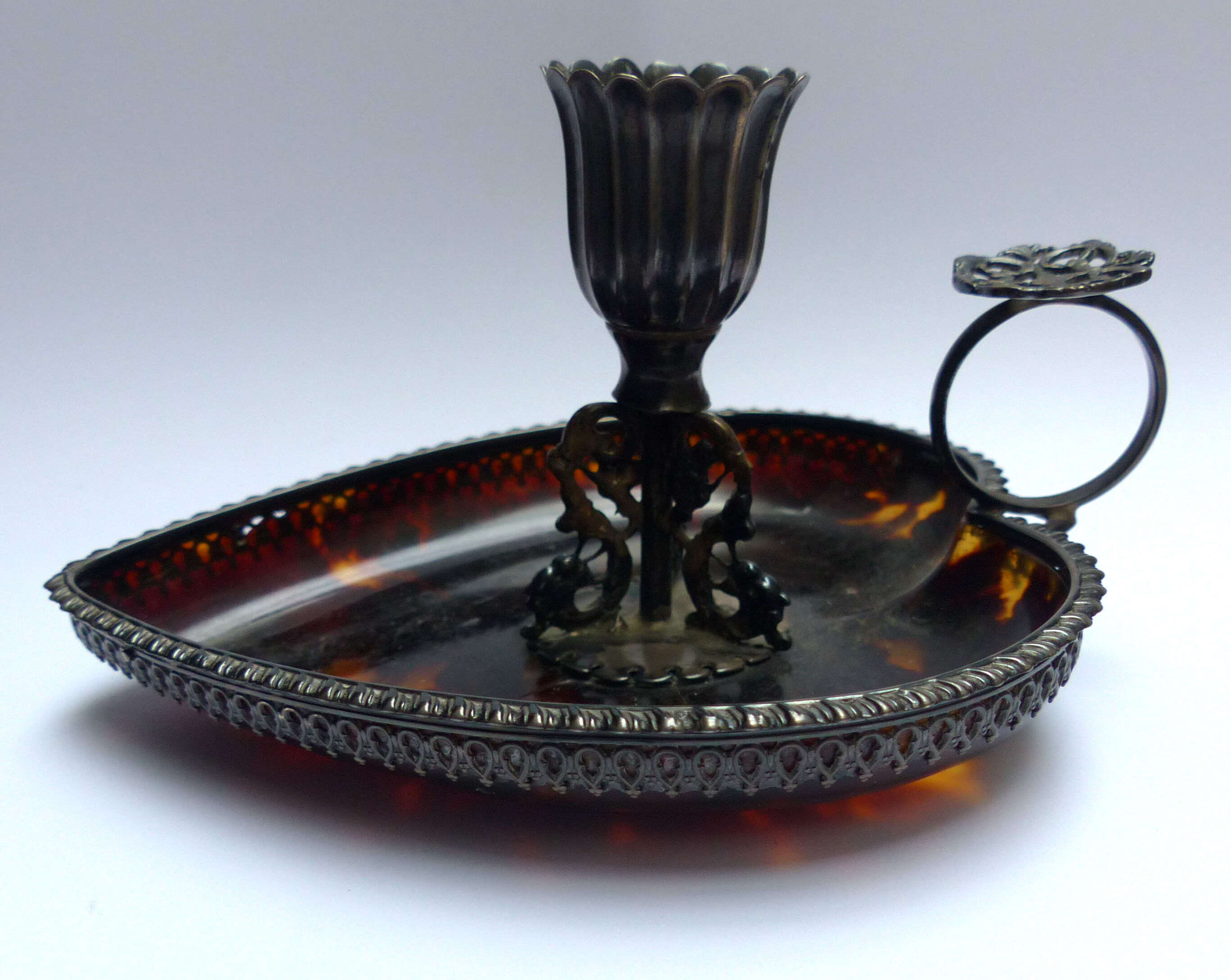 Scaled and silver table candle holder