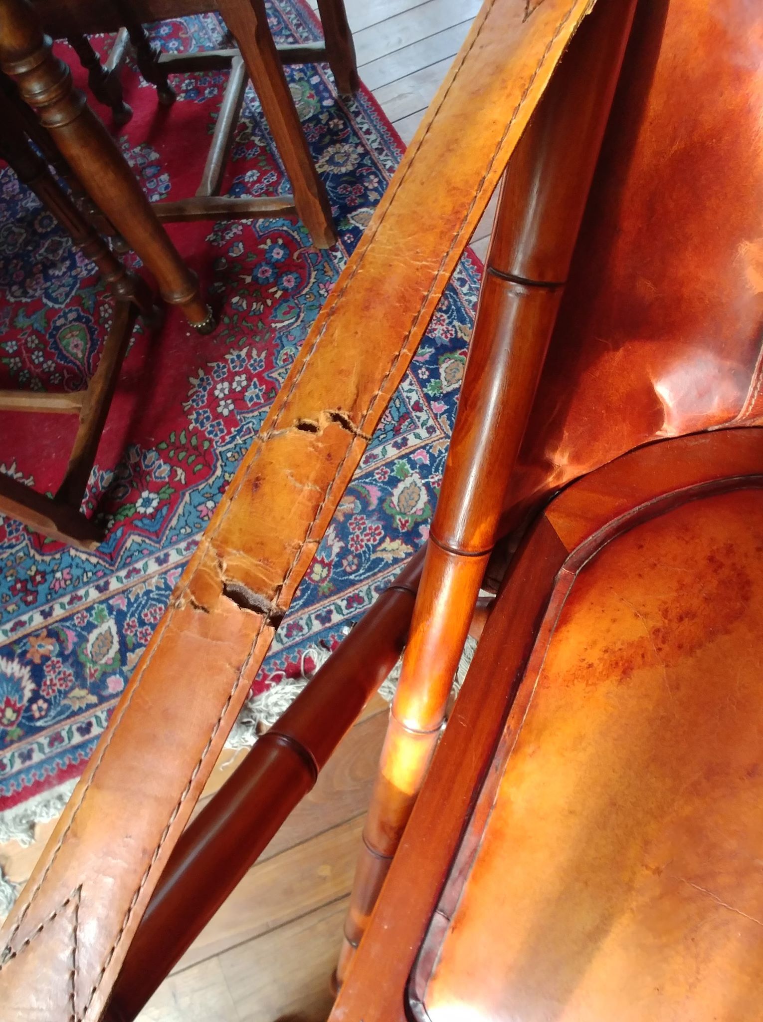 Leather folding armchair and footwork