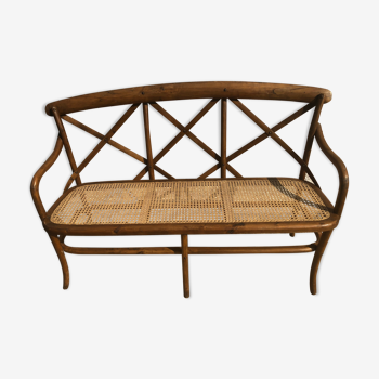 Curved wooden bench and cannage