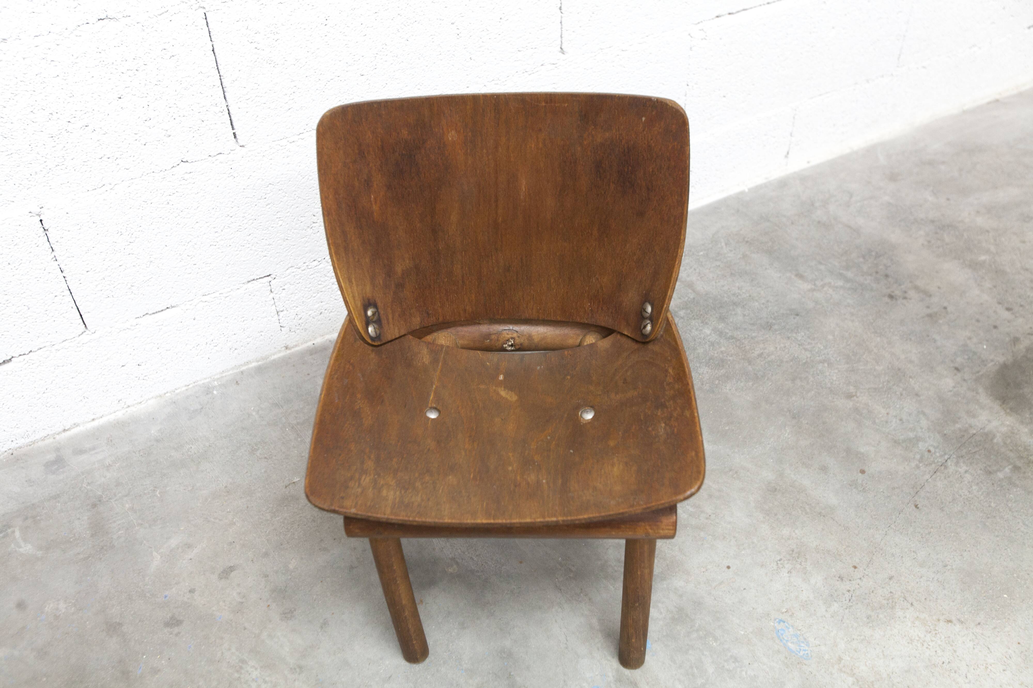 Atypical 1960s curved wood children's chair