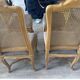 Four antique chairs in classic style with caning and upholstery.