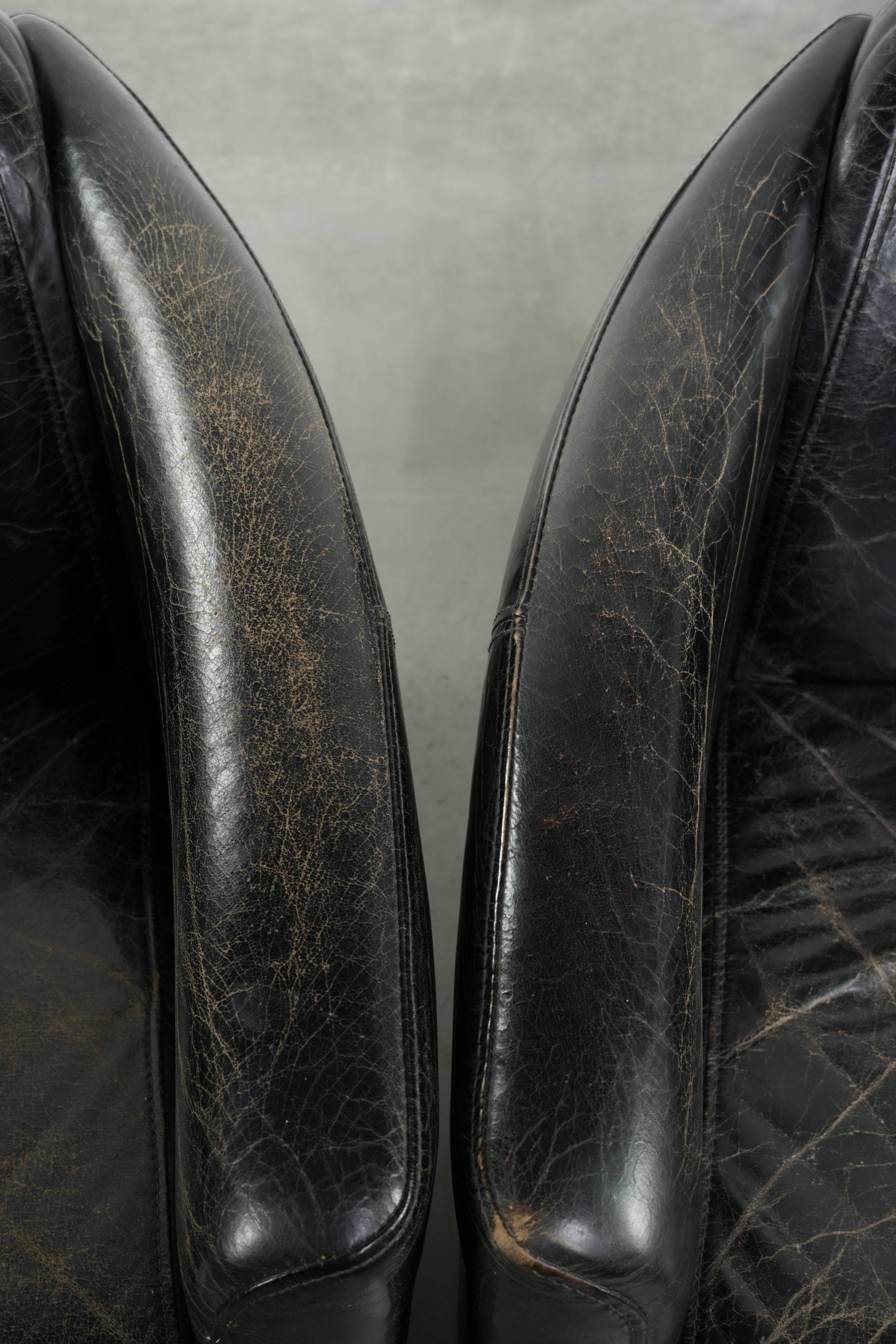 Set of two black vintage cowhide aviator design armchairs